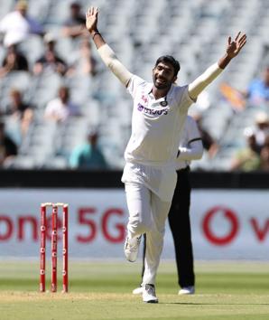 India's Jasprit Bumrah celebrates after taking the wicket of Australia's Joe Burns for no score during play on day one of the Boxing Day cricket test between India and Australia at the Melbourne Cricket Ground, Melbourne, Australia, Saturday, Dec. 26, 2020. (AP Photo/Asanka Brendon Ratnayake) (AP)