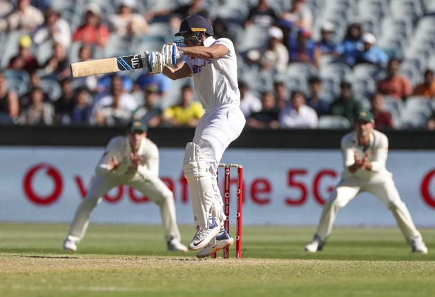 Indian batsman Shubman Gill hits the ball for four runs during play on day one of the Boxing Day cricket test between India and Australia at the Melbourne Cricket Ground, Melbourne, Australia, Saturday, Dec. 26, 2020. (AP Photo/Asanka Brendon Ratnayake) (AP)