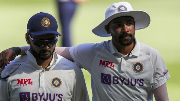 Melbourne : India's Rishabh Pant India's MD Siraj walks from the field during play on day one of the Boxing Day cricket test between India and Australia at the Melbourne Cricket Ground, Melbourne, Australia, Saturday, Dec. 26, 2020 (AP)