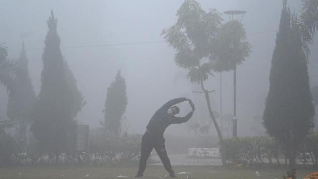 A man exercises in a park amid dense fog in Jalandhar on December 26. Winter may be relatively harsher and longer in north India this year as La Niña, a global weather pattern that has a cooling effect on global weather conditions, has matured and nearly peaked. (PTI)