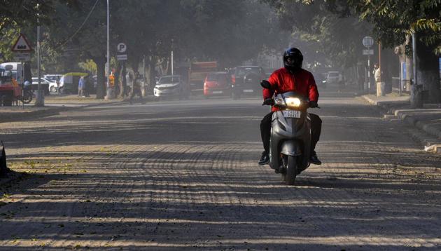 Two-wheeler riders say their vehicles slip while travelling on the road. (Keshav Singh/HT) Two-wheeler riders say their vehicles slip while travelling on the road. (Keshav Singh/HT)