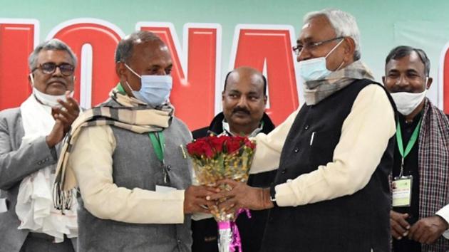 Bihar Chief Minister Nitish Kumar greets newly elected Janata Dal (United) national president RCP Singh during a national executive meeting of the party in Patna on Sunday.(ANI)