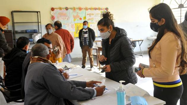 A young woman in Panchkula about to cast her votes in the municipal corporation elections. (HT Photo) A young woman in Panchkula about to cast her votes in the municipal corporation elections. (HT Photo)
