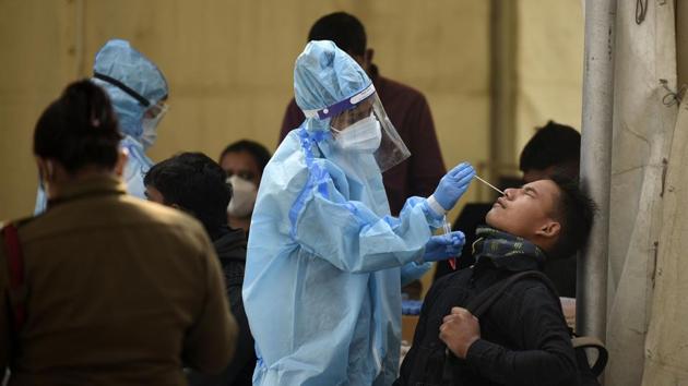 New Delhi, India - Dec. 27, 2020: Incomming travellers being screened for coronavirus infection at Anand Vihar Inter State Bus Terminal (ISBT) in New Delhi, India, on Sunday, December 27, 2020. (Photo by Biplov Bhuyan/ Hindustan Times)