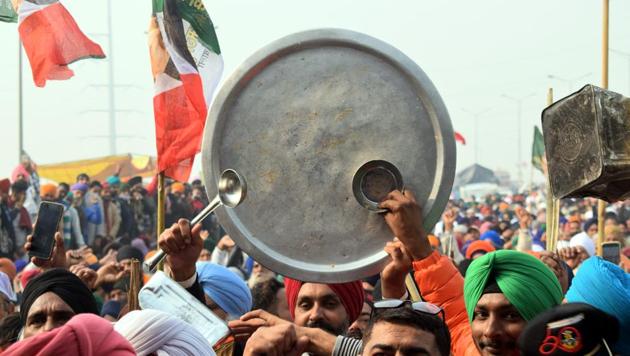 New Delhi India - December 27, 2020: Protesting farmers clank utensils and raise slogans at Delhi-UP border amid protest against new farm laws, in New Delhi, India, on Sunday, December 27, 2020. (Photo by Sakib Ali /Hindustan Times) New Delhi India - December 27, 2020: Protesting farmers clank utensils and raise slogans at Delhi-UP border amid protest against new farm laws, in New Delhi, India, on Sunday, December 27, 2020. (Photo by Sakib Ali /Hindustan Times)