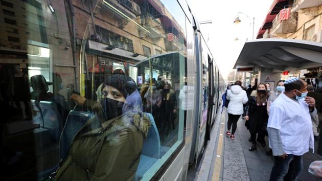 A woman wearing a face mask is seen through the window of a light rail carriage in Jerusalem, Israel on December 24. The Middle East, Africa and Oceania respectively are next on the list of worst-hit Covid-19 regions. (Ammar Awad / REUTERS) A woman wearing a face mask is seen through the window of a light rail carriage in Jerusalem, Israel on December 24. The Middle East, Africa and Oceania respectively are next on the list of worst-hit Covid-19 regions. (Ammar Awad / REUTERS)