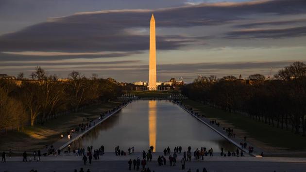 Visitors seen at the Lincoln Memorial with the Washington Monument across the Reflecting Pool in Washington, DC, US on December 26. The individual countries with the largest number of infections are the United States with 19,573,847cases and 341,138 deaths, India (10,208,725cases, 147,940 deaths), Brazil (7,484,285 cases, 191,146 deaths), Russia (3,078,035 cases, 55,265 deaths) and France (2,559,686 cases, 62,746 deaths), according to Worldometers.info. (Samuel Corum / Getty Images / AFP) Visitors seen at the Lincoln Memorial with the Washington Monument across the Reflecting Pool in Washington, DC, US on December 26. The individual countries with the largest number of infections are the United States with 19,573,847cases and 341,138 deaths, India (10,208,725cases, 147,940 deaths), Brazil (7,484,285 cases, 191,146 deaths), Russia (3,078,035 cases, 55,265 deaths) and France (2,559,686 cases, 62,746 deaths), according to Worldometers.info. (Samuel Corum / Getty Images / AFP)