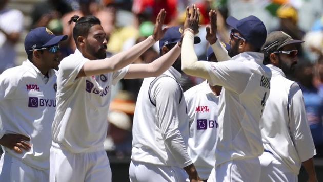 India's MD Siraj, second left, is congratulated by teammates after taking the wicket of Australia's Nathan Lyon during play on day four of the second cricket test between India and Australia at the Melbourne Cricket Ground, Melbourne, Australia, Tuesday, Dec. 29, 2020(AP)