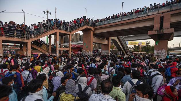 For a large section of India's workforce, the lockdown meant the sudden loss of all security and arduous journeys to faraway homes with all transport suspended overnight. A huge rush of migrant workers who had been marching to their homes, here seen at Anand Vihar Bus Terminal on Day 4 of the lockdown. (Biplov Bhuyan / HT Photo) For a large section of India's workforce, the lockdown meant the sudden loss of all security and arduous journeys to faraway homes with all transport suspended overnight. A huge rush of migrant workers who had been marching to their homes, here seen at Anand Vihar Bus Terminal on Day 4 of the lockdown. (Biplov Bhuyan / HT Photo)