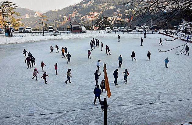 People enjoying ice skating at Asia’s oldest ice skating rink in Shimla on Tuesday.(Deepak Sansta/HT)