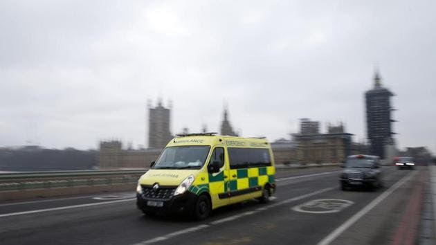 An ambulance crosses Westminster Bridge on December 28 in London. London and southeast England are currently bearing the brunt of the current outbreak, with paramedics in the capital saying they are receiving up to 8,000 emergency calls each day, AFP reported. (Hollie Adams / Getty Images) 