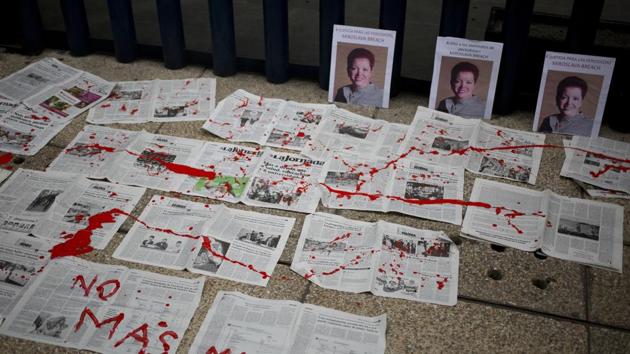 "No More Deaths" is written in red paint on newspapers placed in front of photos of murderd Mexican journalist Miroslava Breach, at the headquarters of Mexico's General Attorney's Office in Mexico City.(AP) "No More Deaths" is written in red paint on newspapers placed in front of photos of murderd Mexican journalist Miroslava Breach, at the headquarters of Mexico's General Attorney's Office in Mexico City.(AP)