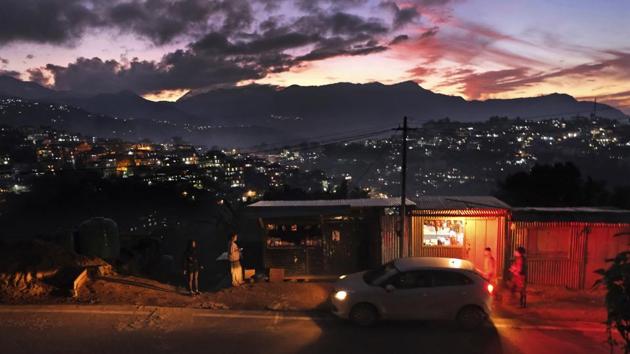 In this file photo, pedestrians seen standing outside roadside shops at dusk in Kohima, capital of Nagaland. (AP) In this file photo, pedestrians seen standing outside roadside shops at dusk in Kohima, capital of Nagaland. (AP)