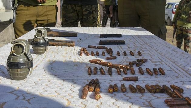 J&K Police display arms and ammunition, recovered from a militant hideout, at Dabi village of Balakote sector in Poonch district.(PTI Photo)
