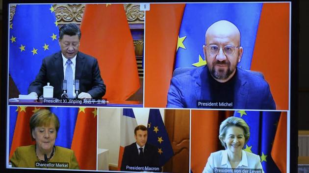 A screen displays live Chinese President Xi Jinping, top left, European Council President Charles Michel, top right, European Commission President Ursula von der Leyen, bottom right, French President Emmanuel Macron, bottom centre, and German Chancellor Angela Merkel during an EU-China Leaders' meeting video conference(AP)