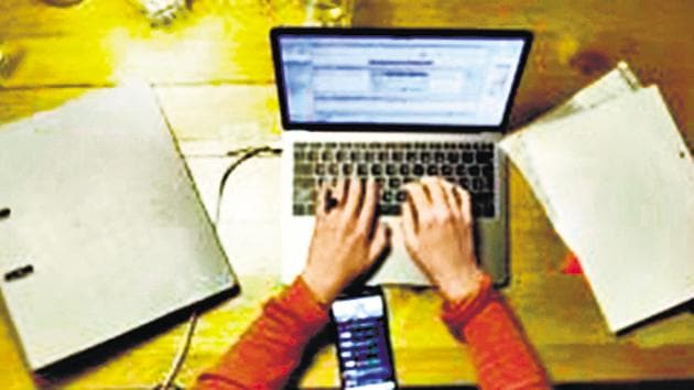 A woman works at a laptop computer at home.(Bloomberg)