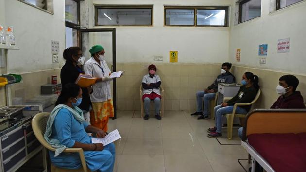 Health workers inside an observation room during a mock drill ahead of the Covid-19 coronavirus vaccination drive at the Public Health Centre (PHC) in Adalaj, Gujarat on December 29. The current Covid-19 numbers are far less than that of September when nearly 92,000 cases were being added in a span of 24 hours. (Sam Panthaky / AFP) Health workers inside an observation room during a mock drill ahead of the Covid-19 coronavirus vaccination drive at the Public Health Centre (PHC) in Adalaj, Gujarat on December 29. The current Covid-19 numbers are far less than that of September when nearly 92,000 cases were being added in a span of 24 hours. (Sam Panthaky / AFP)
