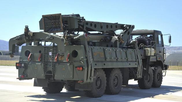 A truck carrying parts of the S-400 air defense systems, exits a Russian transport aircraft after landing at Murted military airport outside Ankara, Turkey. (AP)