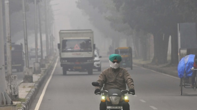 Commuters on their way during foggy weather in Chandigarh. (Photo by Keshav Singh/Hindustan Times.) Commuters on their way during foggy weather in Chandigarh. (Photo by Keshav Singh/Hindustan Times.)