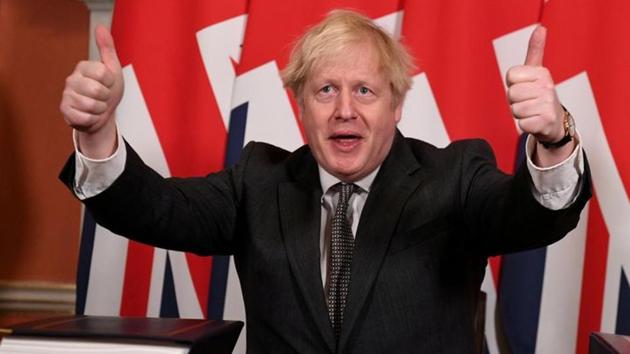 Britain's Prime Minister Boris Johnson gives a thumbs up after signing the Brexit trade deal with the EU at number 10 Downing Street in London on Wednesday.(REUTERS PHOTO.)