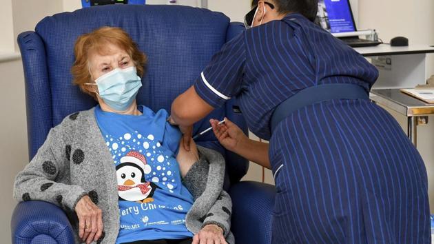 Margaret Keenan, the first patient in the UK to receive the Pfizer-BioNTech Covid-19 vaccine, administered by nurse May Parsons.(File photo / AP)