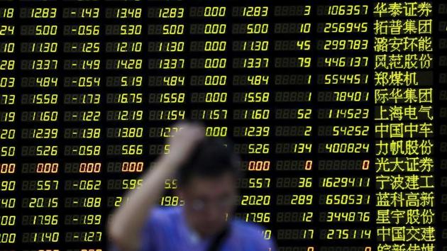 An investor stands in front of an electronic board showing stock information at a brokerage house. (REUTERS/For Representative Purposes Only) An investor stands in front of an electronic board showing stock information at a brokerage house. (REUTERS/For Representative Purposes Only)