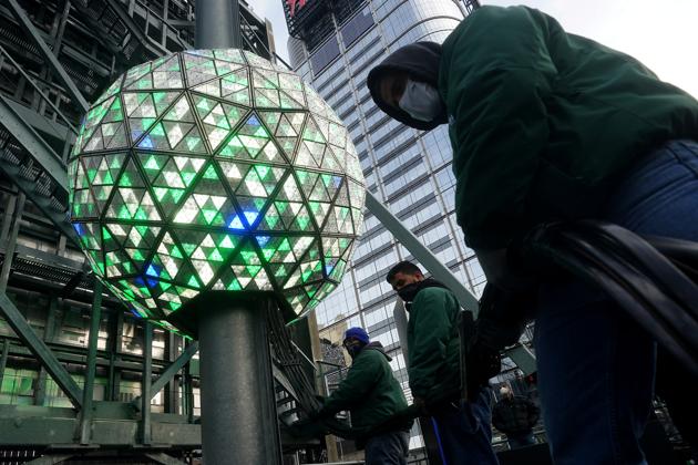 The Times Square ball is tested out for the media ahead of the New Year's celebration in Times Square amid the coronavirus disease (Covid-19) pandemic in the Manhattan borough of New York City, New York. (REUTERS) The Times Square ball is tested out for the media ahead of the New Year's celebration in Times Square amid the coronavirus disease (Covid-19) pandemic in the Manhattan borough of New York City, New York. (REUTERS)