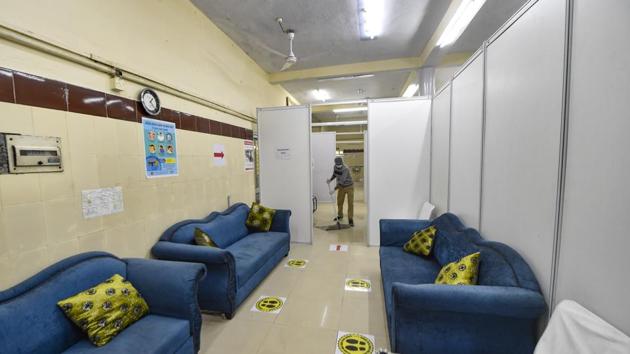 A worker cleans the national capital's first Covid-19 vaccination centre at Srinivaspuri area in New Delhi.(PTI) A worker cleans the national capital's first Covid-19 vaccination centre at Srinivaspuri area in New Delhi.(PTI)