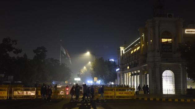 Police barricading on Connaught Place’s Outer Circle in view of New Year’s Eve, at Janpath in New Delhi, India. (Photo by Sanjeev Verma/Hindustan Times) Police barricading on Connaught Place’s Outer Circle in view of New Year’s Eve, at Janpath in New Delhi, India. (Photo by Sanjeev Verma/Hindustan Times)