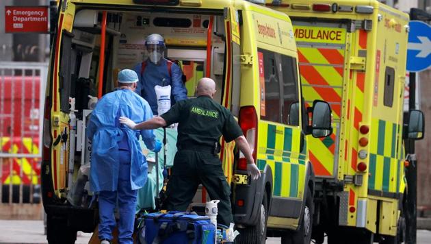 Medics transport a patient from an ambulance to the Royal London Hospital as the spread of the coronavirus disease (COVID-19) continues in the UK. (REUTERS) Medics transport a patient from an ambulance to the Royal London Hospital as the spread of the coronavirus disease (COVID-19) continues in the UK. (REUTERS)