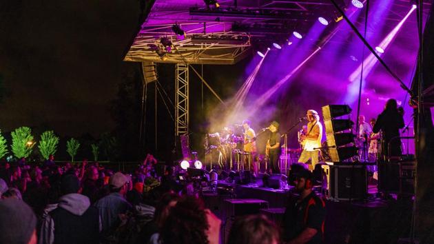 People watch New Zealand band “The Black Seeds” perform during New Year's Eve celebrations at Hagley Park in Christchurch, New Zealand on January 1. New Zealand and its South Pacific island neighbours have no Covid-19, and New Year celebrations there were the same as ever. (Ernest Kung / AP)