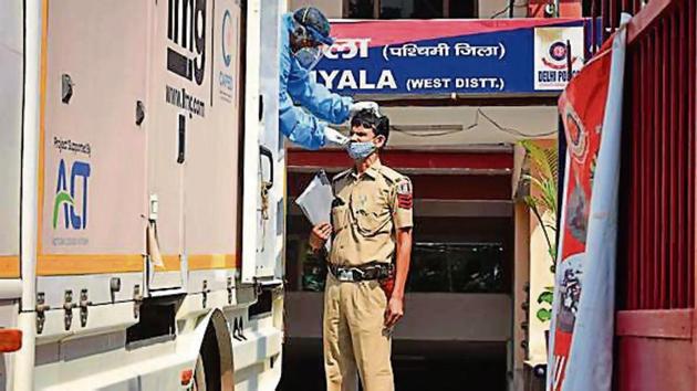 A policeman gets tested for Covid-19 at Khyala Police Station in New Delhi. (Sanchit Khanna/ HT Archive) A policeman gets tested for Covid-19 at Khyala Police Station in New Delhi. (Sanchit Khanna/ HT Archive)