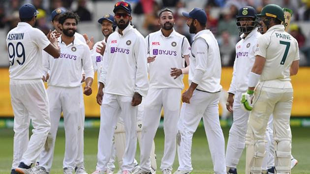 Members of the Indian cricket team celebrate Tim Paine’s dismissal in Melbourne.(Getty Images)