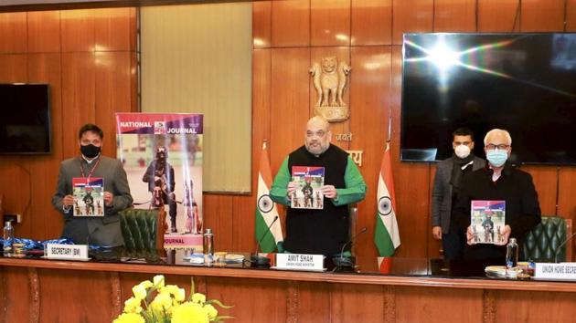 Union home minister Amit Shah releases the inaugural issue of the 'National Police K-9 Journal' of the Union Home Ministry's Police Modernisation Division, in New Delhi on Saturday.(PTI Photo)