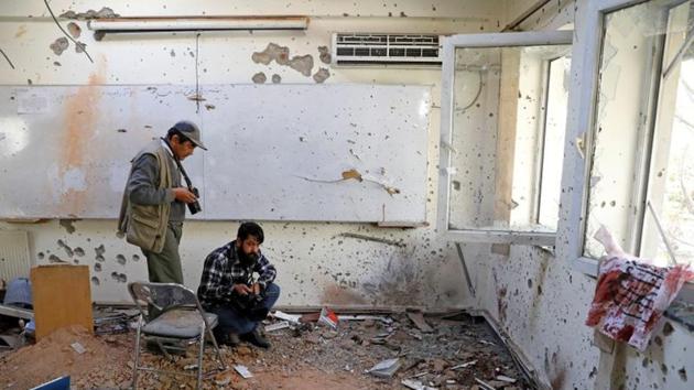 Afghan journalists film inside a class after the attack at the University of Kabul, Afghanistan.(REUTERS) Afghan journalists film inside a class after the attack at the University of Kabul, Afghanistan.(REUTERS)
