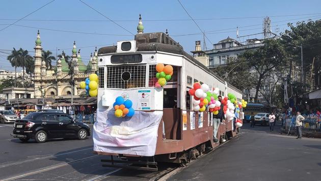 A tram carrying passengers runs on a track to raise awareness against the coronavirus on the New Year's eve at Esplannade Tram depot in Kolkata.(PTI) A tram carrying passengers runs on a track to raise awareness against the coronavirus on the New Year's eve at Esplannade Tram depot in Kolkata.(PTI)