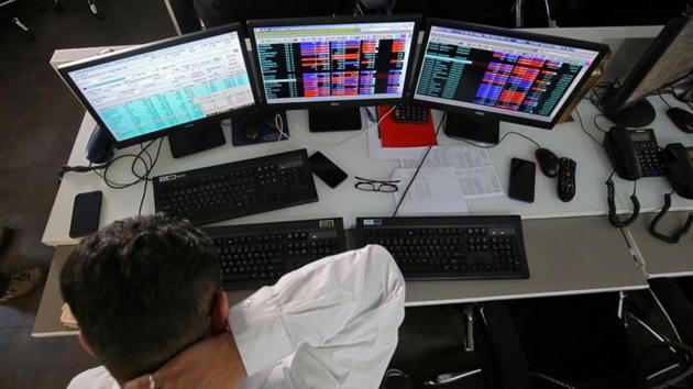A broker reacts while trading at his computer terminal at a stock brokerage firm in Mumbai, India.(REUTERS) A broker reacts while trading at his computer terminal at a stock brokerage firm in Mumbai, India.(REUTERS)