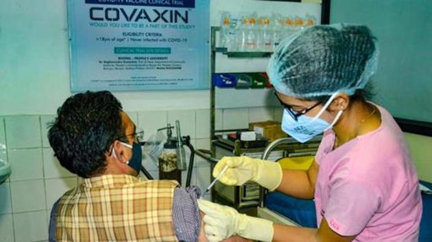 A medic administers Covaxin, developed by Bharat Biotech in collaboration with the Indian Council of Medical Research (ICMR), during the Phase- 3 trials.(PTI)