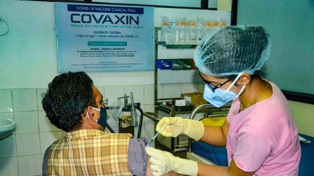 A medic administers Covaxin, developed by Bharat Biotech in collaboration with the Indian Council of Medical Research (ICMR), during the Phase- 3 trials at the People's Medical College in Bhopal.(PTI)