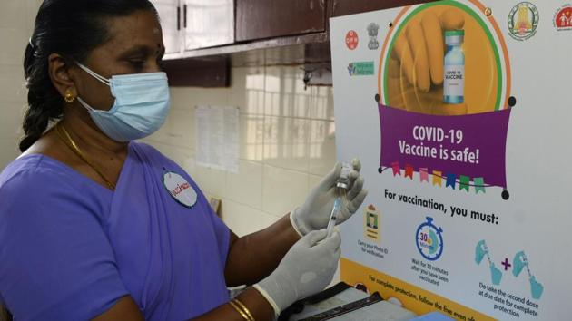 A health official prepares a vaccine kit during a mock drill for Covid-19 vaccine delivery at a primary health centre in Chennai on January 2. The dip in fresh Covid-19 infections from 20,035 cases on January 1, comes on a day India started a dry run for its vaccination programme across all states and Union territories. (Arun Sankar / AFP)