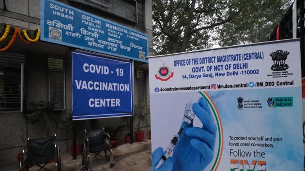 Banners outside a Covid-19 vaccination center set up in Delhi, India, on Saturday, Jan. 2, 2021.(Bloomberg)