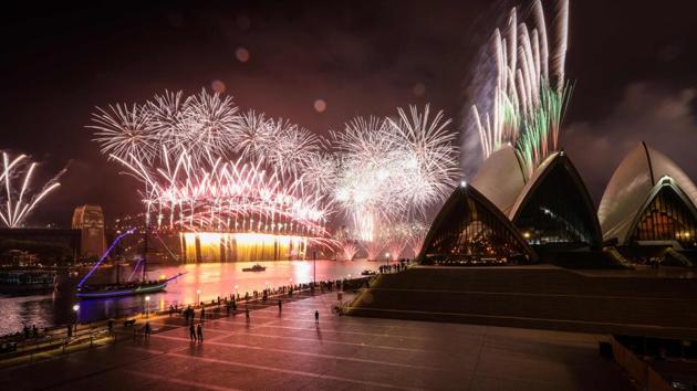A deserted Sydney Opera House forecourt can be seen in front of fireworks exploding from the Sydney Harbour Bridge during New Year celebrations in central Sydney.(AFP)