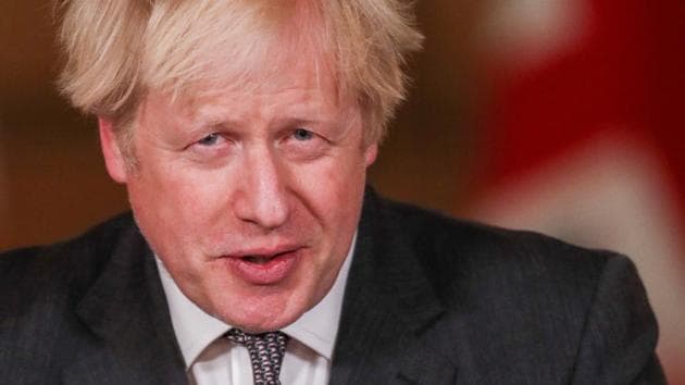Britain's Prime Minister Boris Johnson speaks during a news conference at Downing Street in London.