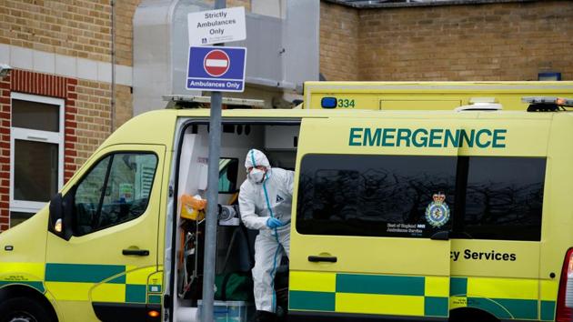 A healthcare worker wearing personal protective equipment (PPE) gets out of the ambulance outside the Southend University Hospital, as the coronavirus disease (Covid-19) hospital admissions rise in the UK, in Southend-On-Sea, Britain. (Reuters) A healthcare worker wearing personal protective equipment (PPE) gets out of the ambulance outside the Southend University Hospital, as the coronavirus disease (Covid-19) hospital admissions rise in the UK, in Southend-On-Sea, Britain. (Reuters)