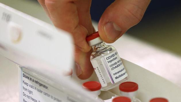 Doses of the Covid-19 vaccine developed by Oxford University and UK-based drugmaker AstraZeneca are checked as they arrive at the Princess Royal Hospital in Haywards Heath, England on Saturday.(AP File Photo)