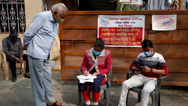 A man registers his name for vaccination for the coronavirus disease (COVID-19) at a health centre in Ahmedabad, Gujarat.(REUTERS)