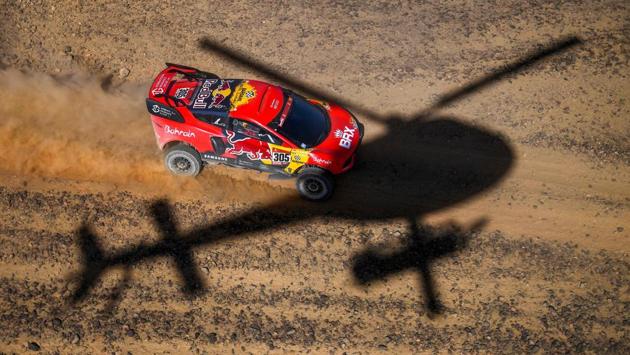 French driver Sebastien Loeb and co-driver Daniel Elena of Monaco compete during Stage 1 between Jeddah and Bisha, on January 3. A raft of new safety measures include compulsory airbag vests for motorbike riders, warnings that will notify competitors in the approach to potential dangers with designated “slow zones” limiting the speed to 90km/h in especially tricky sectors. (Franck Fife / AFP)