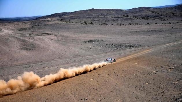 Mini's Spanish driver Carlos Sainz and co-driver Lucas Cruz during Stage 1 on January 3. Toyota driver Nasser al-Attiyah, a three-time winner of the event earned the right to start first in the January 4 opening stage, a 622km run from Jeddah to Bisha in the southeast of the kingdom. Attiyah faces stiff competition from reigning champion Carlos Sainz of Spain. (Franck Fife / AFP)