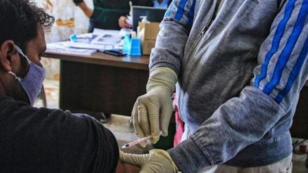 A volunteer being vaccinated by a medic during the Bharat Biotech's 'Covaxin' human trial in Jaipur.(PTI)