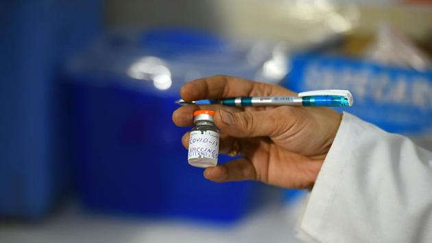 A health worker holds a vial during a dry run of the Covid-19 vaccination programme, at Guru Teg Bahadur Hospital in New Delhi on January 2. While there has been criticism from a large section of experts about the way approvals were given without adequate efficacy data, some experts say there is a provision for such approvals in the Indian regulatory system during emergency situations such as a pandemic. (Raj K Raj / HT Photo) A health worker holds a vial during a dry run of the Covid-19 vaccination programme, at Guru Teg Bahadur Hospital in New Delhi on January 2. While there has been criticism from a large section of experts about the way approvals were given without adequate efficacy data, some experts say there is a provision for such approvals in the Indian regulatory system during emergency situations such as a pandemic. (Raj K Raj / HT Photo)